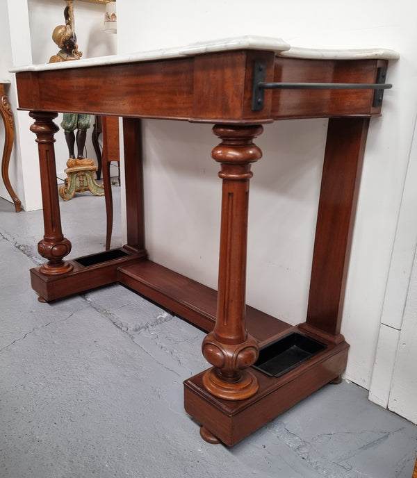 Classic Victorian mahogany console table with white marble top, one drawer and accommodation for sticks/umbrellas. In good original detailed condition.