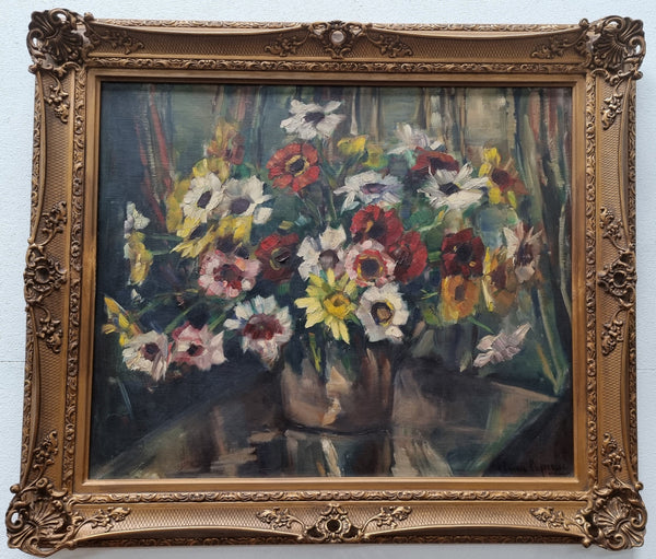 Sourced in France is this beautiful floral oil painting on canvas and framed in a lovely decorative frame. It is in good original condition.