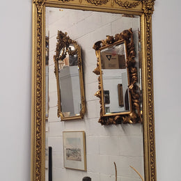 Impressive French Napoleon III water gilded mantle mirror. It is beautifully decorated with allegorical themes and has been sourced from France. In good original detailed condition with original mirror.