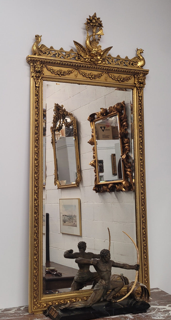 Impressive French Napoleon III water gilded mantle mirror. It is beautifully decorated with allegorical themes and has been sourced from France. In good original detailed condition with original mirror.