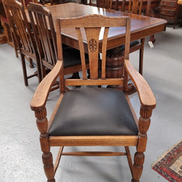Tudor oak dining setting consisting of draw leaf extension table, 4 dining chairs and 2 carver chairs. Upholstery in excellent condition. Circa: 1930’s. The table, chair and carver chairs are in good original detailed condition.