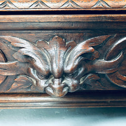 Amazing dark Oak heavily carved Gothic style bookcase with lovely details and adjustable shelves in good original detailed condition. The doors currently have no glass which can easily be added or be left  with open shelves.