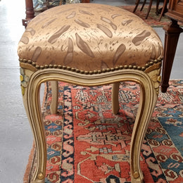 Appealing French Louis 15th style hand painted and gilded stool with good upholstery. In good original detailed condition.