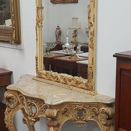 Beautifully carved Italian Rococo style painted console/hall table and mirror. An amazing coloured marble top showing sections of gold veins and is in good condition. Mantle mirror is retaining it's original mirror and showing ages spots.