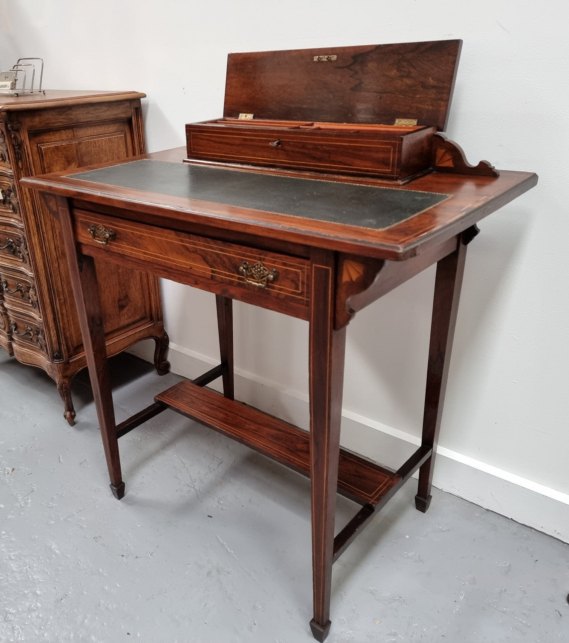 Edwardian Sheraton style desk with a tooled leather insert top with beautiful marquetry inlay. In good original detailed condition. Circa: 1910's