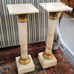 Pair of Imposing French alabaster marble and bronze pedestals. They are highly decorative and have been sourced from France. They are in good original detailed condition.