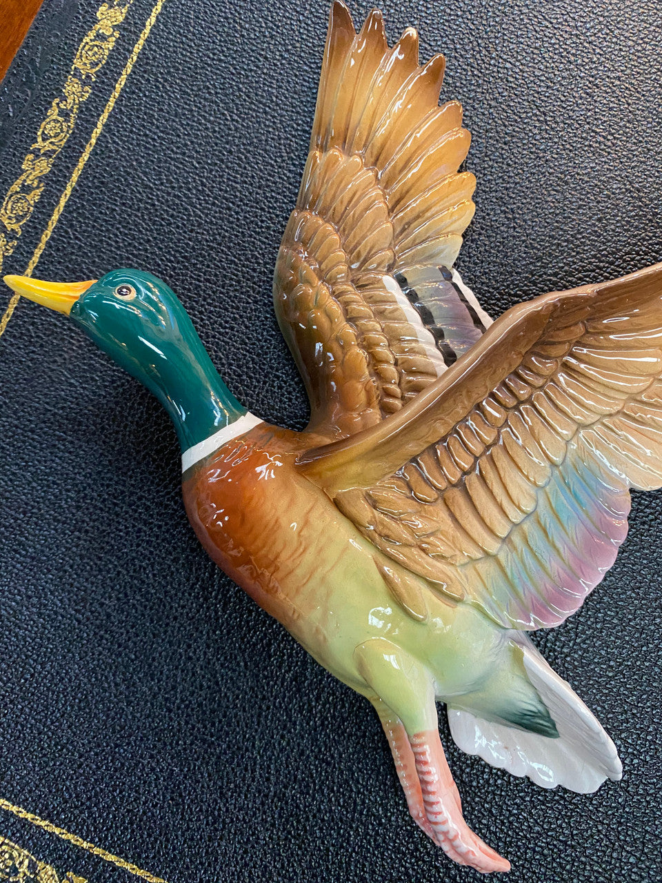 Set of three vintage flying duck wall ornaments. Measurements are for largest duck.