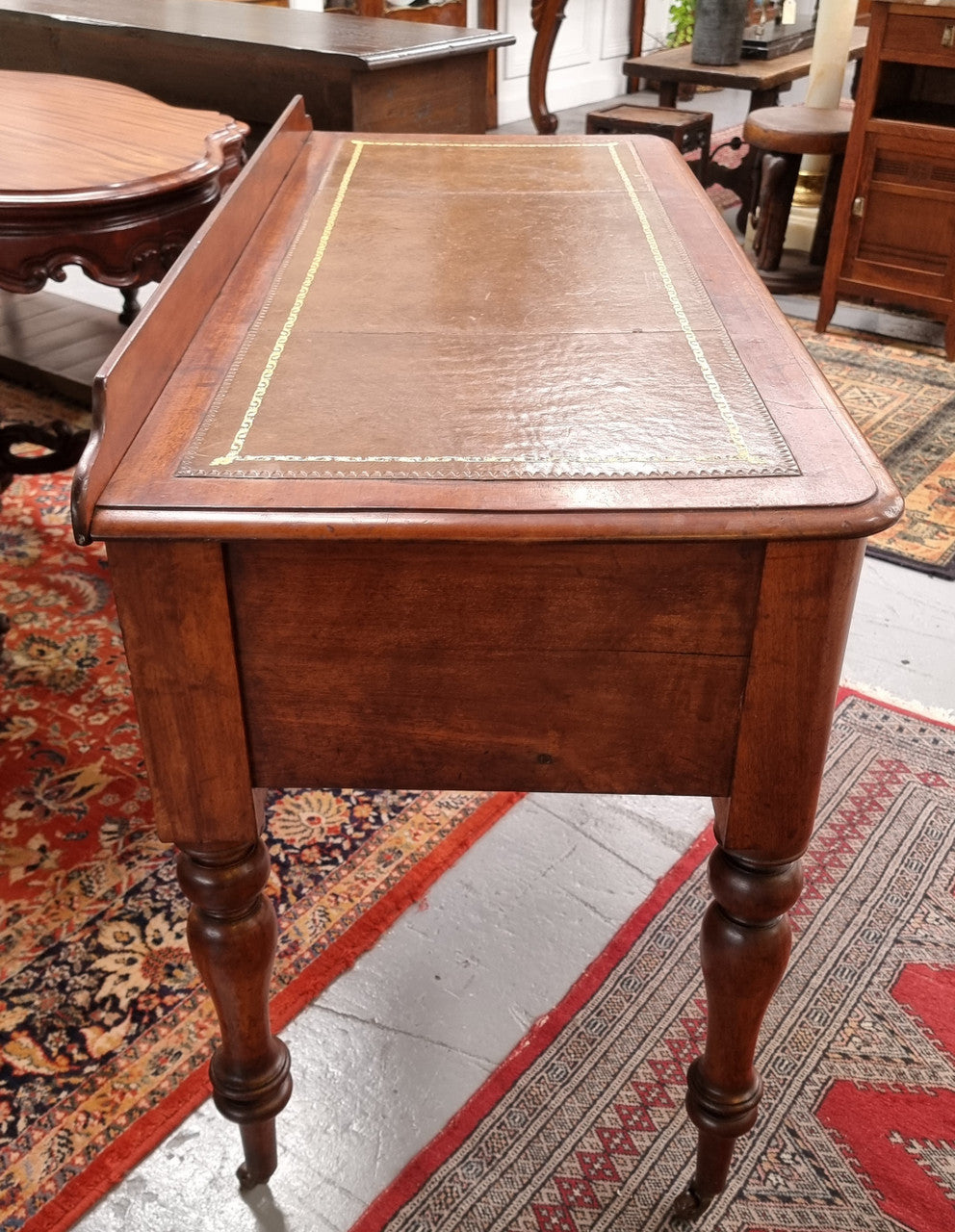 Lovely Victorian Cedar leather tooled  top desk, with five drawers on castors and of pleasing proportions. In very good original detailed condition and has been sourced locally.