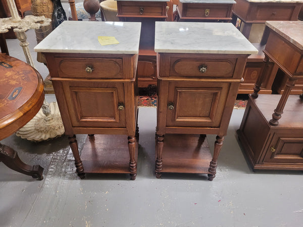 Antique French Oak Henry II white marble top bedside cabinets. They have one drawer and cupboard a long with an open shelf at the bottom. Sourced from France and in good original detailed condition.