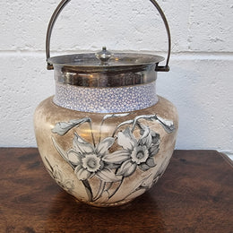 Royal Doulton Biscuit Barrel with silver plated top, handle and lid. Displaying a Daffodil pattern. In original condition please view photo's as they form part of the description.