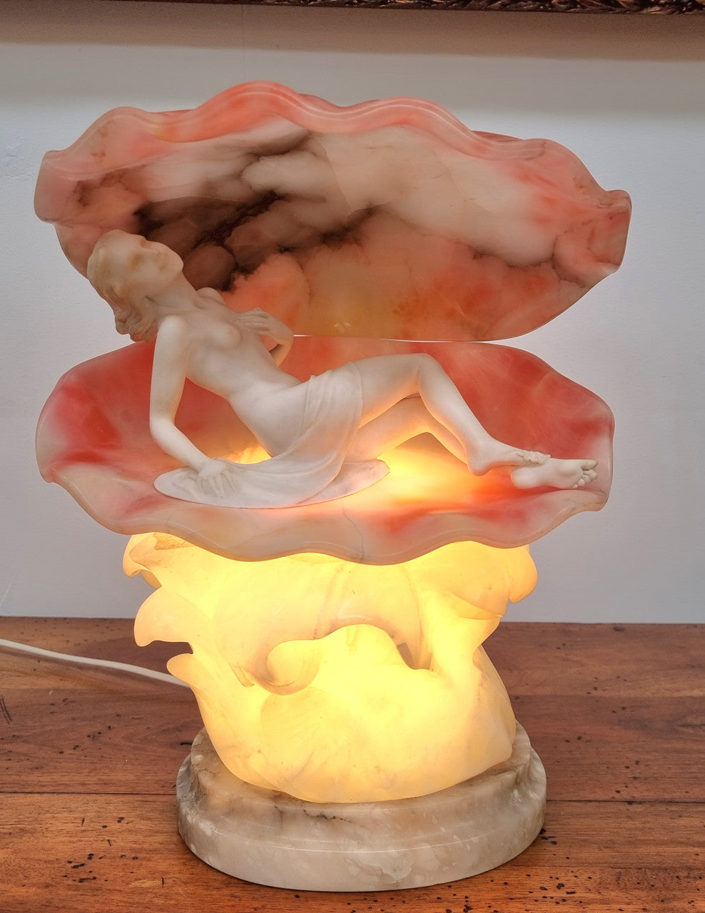 A superb original hand carved Art Deco lamp. Alabaster and marble sculpture of a nude woman inside a clam shell. Italian, inscription to base. Circa 1920's. Subtle colouring to clam shell for a sunset effect. This is a world class example of a true Art Deco sculpture lamp. It is in good original detailed condition, please view photos as they help form part of the description.