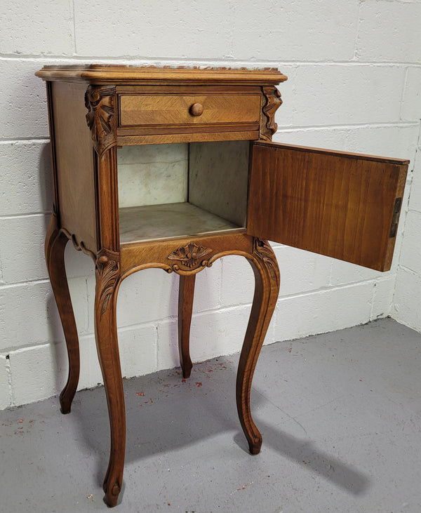 Single French Louis XV style Walnut inset marble top bedside. It has one drawer and one cupboard. It is in good original detailed condition.
