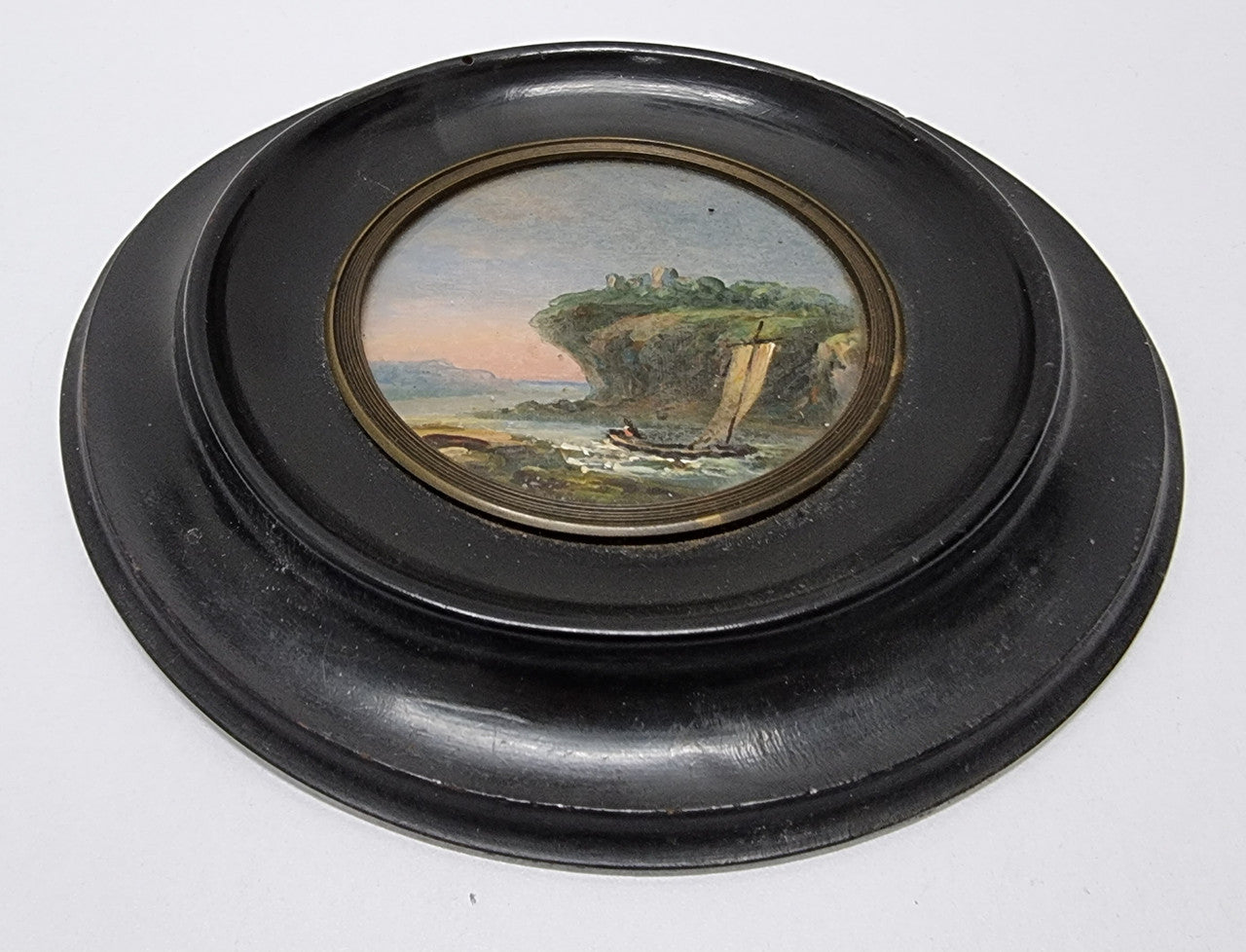 Victorian hand painted miniature sea scene. It is in good original condition and has been sourced locally. Please view photos as they help form part of the description.