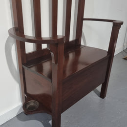 Blackwood Federation hall stand of pleasing narrow proportions. Beautiful round mirror with four lovely hooks and a lift up sit for added storage. In good original condition.