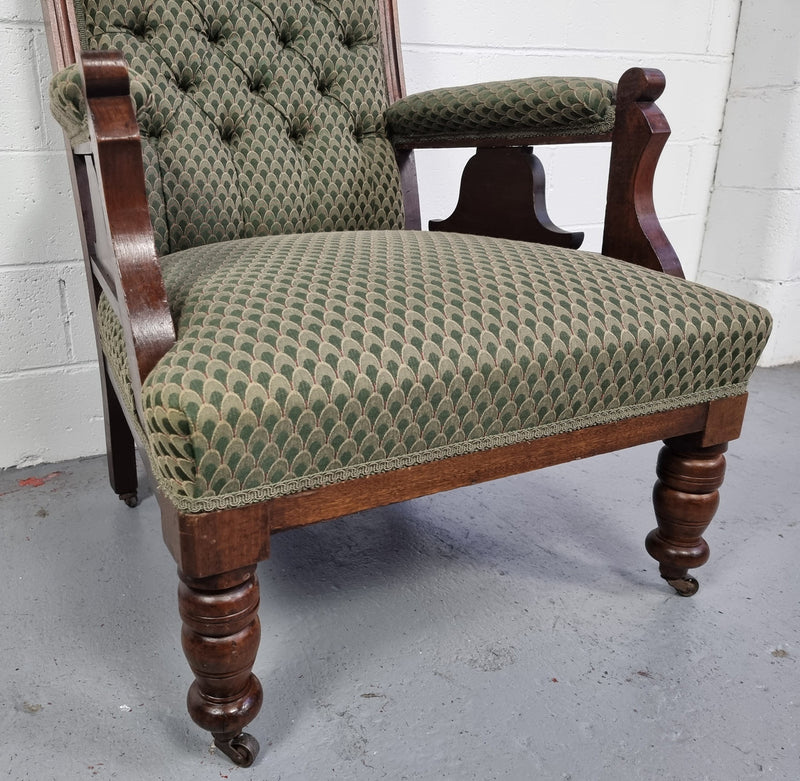 Pair of Edwardian button back Walnut armchairs. They are in good original condition with clean upholstery.