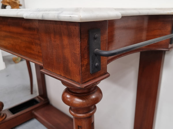 Classic Victorian mahogany console table with white marble top, one drawer and accommodation for sticks/umbrellas. In good original detailed condition.