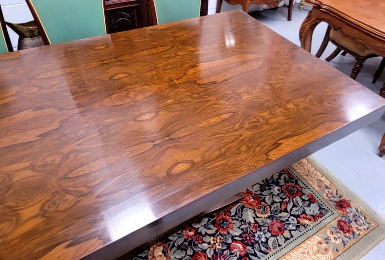 French Art Deco Figured Walnut dining table and six chairs. This stylish table also comes with a glass top and can be used with or without it. The chairs are very comfortable and the table can also fit another two chairs at either end making it a 6-8 seater. The table is in good original detailed condition with character marks to the top of table as shown in the pictures. This table and six chairs have been sourced locally.