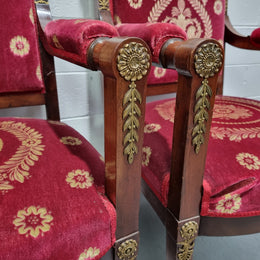 Pair of large French Empire style armchairs with ormolu mounts and impressive red upholstery. They are in good original condition.