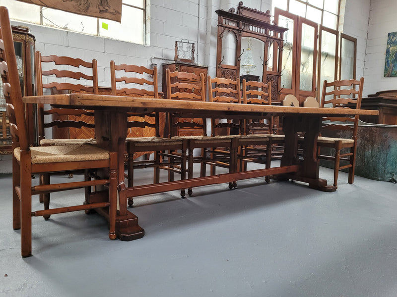 Reclaimed Pine and Oregon stretcher base dining table. The top has an amazing patina and character. Can very comfortable seat 12 and is in good original detailed condition .