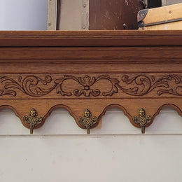 French Oak hanging wall rack with seven hooks. It has been sourced from France and is in good original detailed condition.