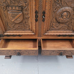 Large French Oak Renaissance style four door sideboard/buffet. Great decorative item with amazing carvings and stunning iron work on base. It is in good original detailed condition. Can pull apart completely making it easier to move.