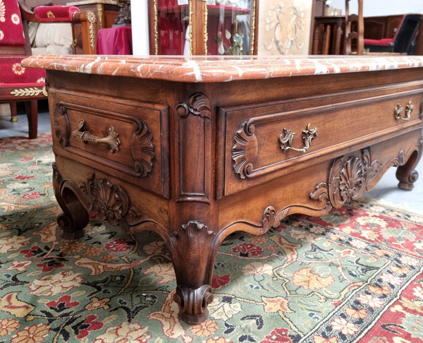 Amazing original walnut Louis XV style coffee table with a marble top, one drawer on either end and a faux drawer at the front. In good original detailed condition, sourced in France.