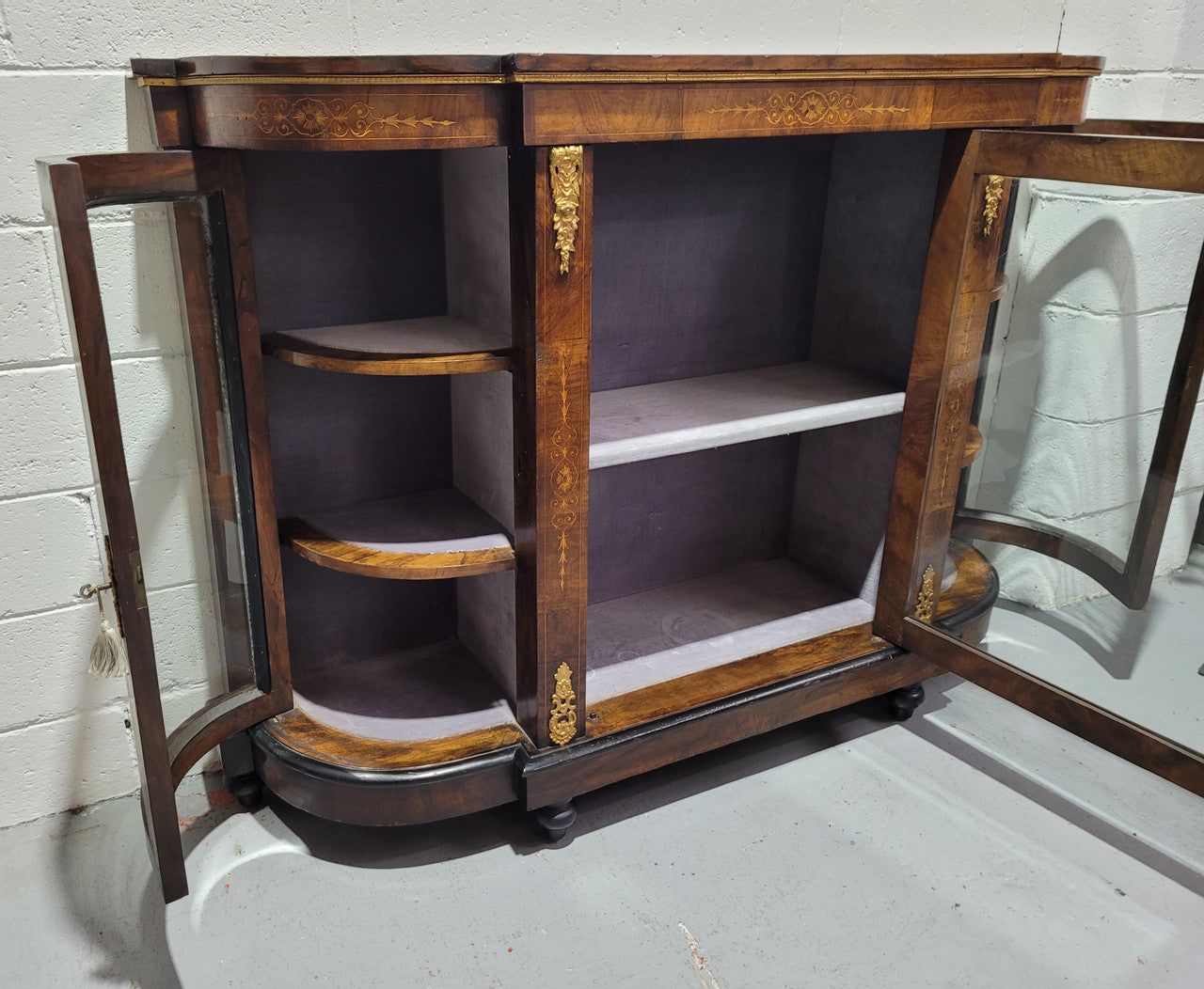 Victorian Rosewood inlaid side cabinet/credenza with velvet lined shelves and gilt mounts. It has been sourced locally and is in good original condition with loads of character.