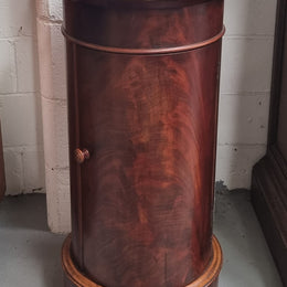 Unusual Empire flame Mahogany cylindrical marble topped bedside/pedestal. Would make an ideal pedestal with added storage inside or could be used as a bedside. Sourced from France and is in good original detailed condition.