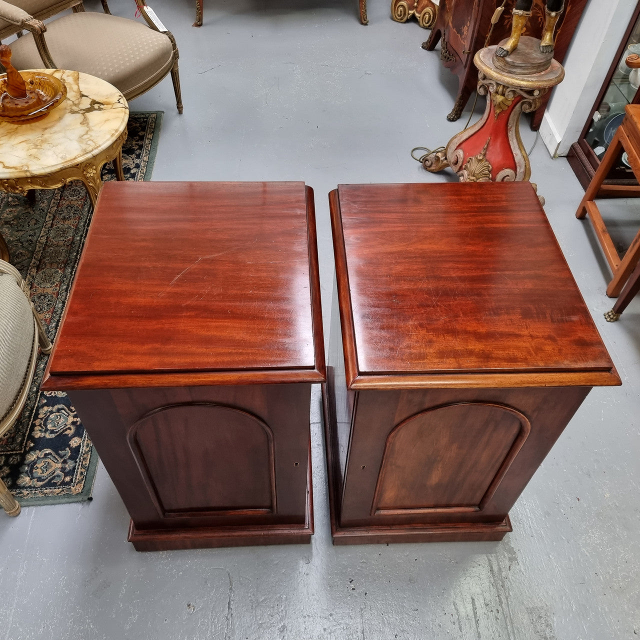 Unique pair of Victorian mahogany bedsides with one fixed shelf. Sourced locally and in good original detailed condition.