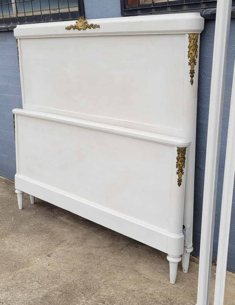 French Louis 16th style chalk painted queen size bed with gilt decorative mounts and includes custom slats. It has been sourced from France and in good original condition.