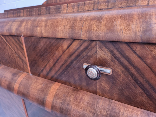 Vintage Walnut Art Deco “Waterfall” sideboard buffet with two drawers and two doors. It is in good original condition and has been sourced locally.