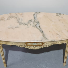 Charming painted Louis XVI style oval marble top coffee table. In good original detailed condition.