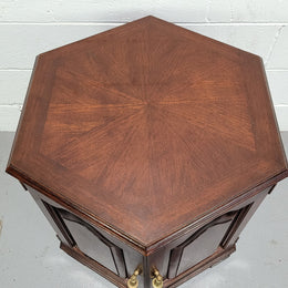 Hexagonal Mahogany enclosed side cabinet with two doors. Would make an ideal side cabinet and is in good restored condition.
