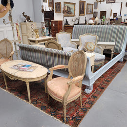 French chalk painted Louis XV style king size bed. Hard to find and newly upholstered in complimentary striped fabric. It has two small secret drawers at the back and stunning lion feet. It fits a king size mattress and base internally and custom slats could be made at request to accommodate a king size mattress, this would be an additional cost. It has been sourced from France and is in good original detailed condition.