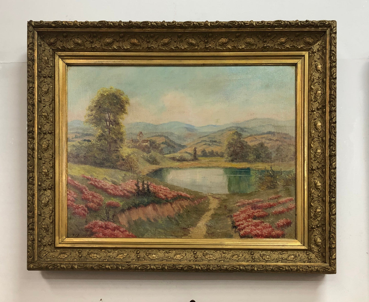 Beautiful French country scene oil on canvas in a lovely decorative frame in good original condition..