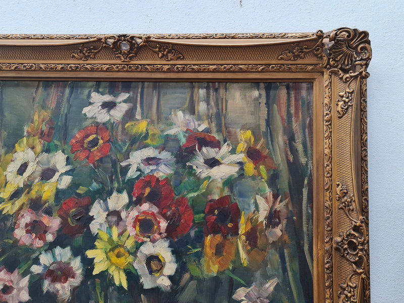 Sourced in France is this beautiful floral oil painting on canvas and framed in a lovely decorative frame. It is in good original condition.