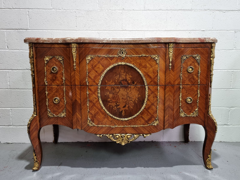 Stunning Louis XV style ormolu and marquetry marble top commode with two drawers. It has an amazing thick marble top and it is in good original detailed condition.