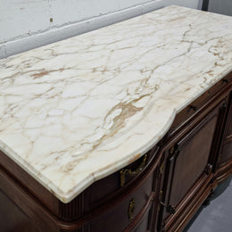 Fabulous French Walnut Louis XVI style cupboard, with a lovely marble top and nine drawers. There is also a cupboard and beautiful ormolu mounts. It is in good original detailed condition.