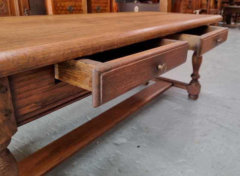 Fabulous Rustic French Oak coffee table with two drawers. It is in good original detailed condition.