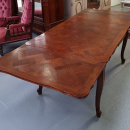 Beautiful French Oak Louis XV style parquetry top extension table. When fully extended the tables length is 239 cm. It is in good original detailed condition.