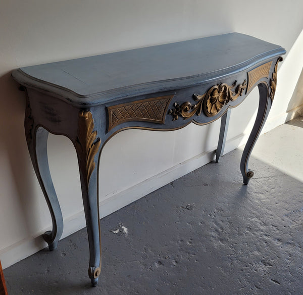 Stylish Louis 15th style console table with chalk paint and gilded highlights. They have been sourced from France and is in good original condition.