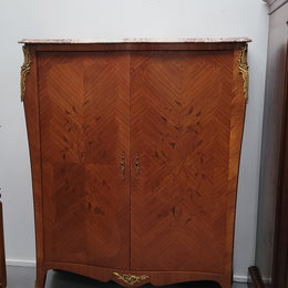 French Louis 15th style Kingwood marquetry inlaid two door cupboard with a beautiful marble top. It has three adjustable shelves and decorative ormolu trim. It has been sourced from France and is in good original detailed condition.