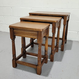 Lovely tudor oak style three nest tables. Circa 1950, In good original detailed condition.