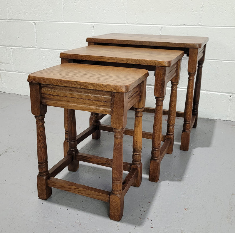 Lovely tudor oak style three nest tables. Circa 1950, In good original detailed condition.