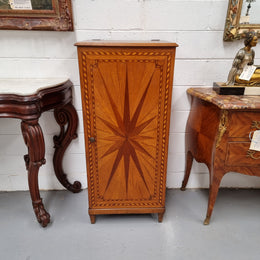 French Art Deco inlaid Oak curio/side cabinet with a lift up top and glass underneath. There are two fixed shelves, two adjustable shelves and one hidden drawer. Sourced from France and in good original condition.