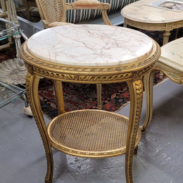 Stunning Louis XV style two tier marble topped gilt lamp/side table. It has been sourced from France and is in good original detailed condition.