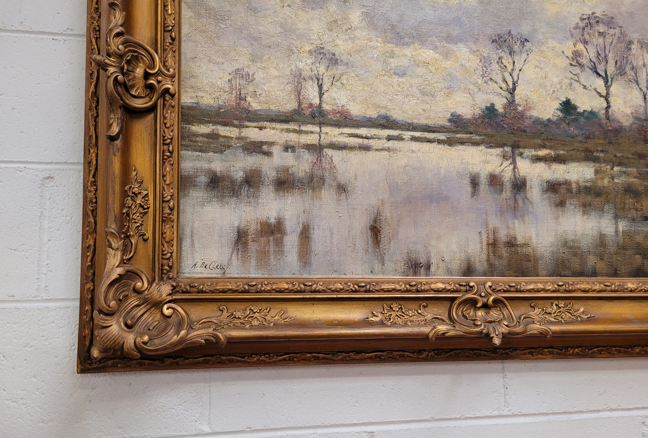 Sourced from France an impressionist oil painting of a beautiful lake scene. It is nicely framed in an Antique frame and in good original detailed condition.