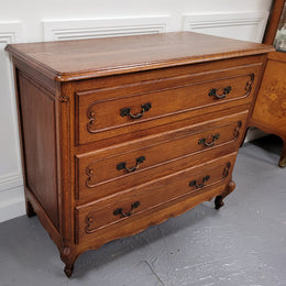 French Louis 15th style Oak three drawer chest of drawers with wooden top. It has been sourced from France and is in good original detailed condition.