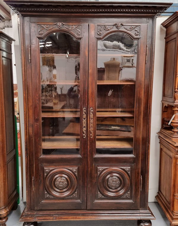 Substantial French Henry 2nd Walnut two door bookcase. It has five fully adjustable shelves and has been sourced from France. It is in good original detailed condition.