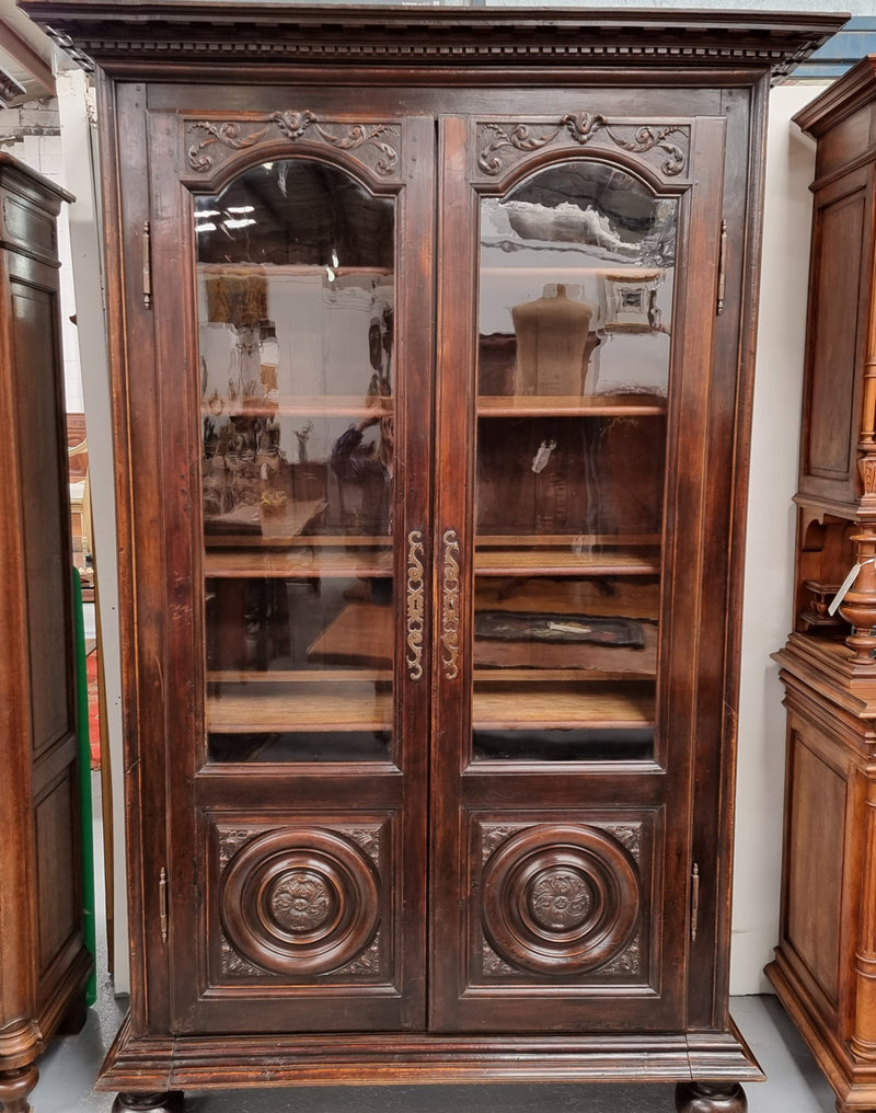 Substantial French Henry 2nd Walnut two door bookcase. It has five fully adjustable shelves and has been sourced from France. It is in good original detailed condition.